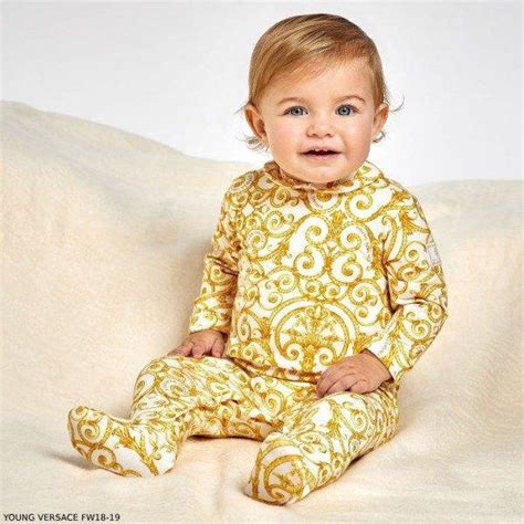 young versace gold baroque babygrow|Versace dresses for kids.